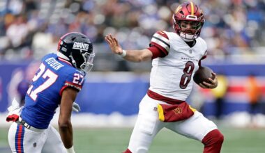 Washington Commanders quarterback Marcus Mariota ran with the ball against the New York Giants on Sunday in East Rutherford, N.J.