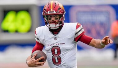 Washington Commanders quarterback Marcus Mariota carried the ball against the New York Giants on Sunday in East Rutherford, N.J.