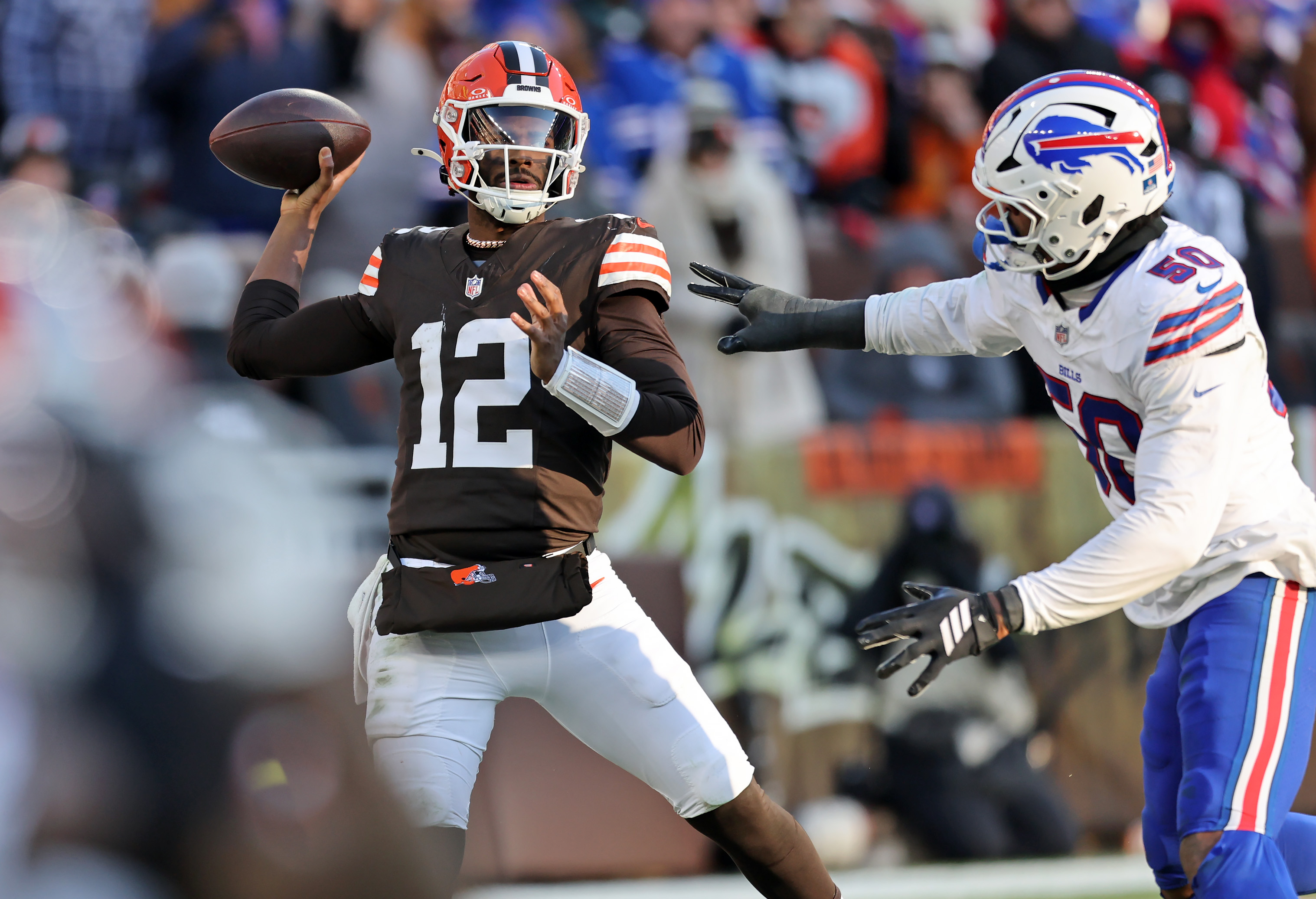 Cleveland Browns quarterback Shedeur Sanders throws under pressure from Buffalo Bills defensive end Greg Rousseau in the second half. 