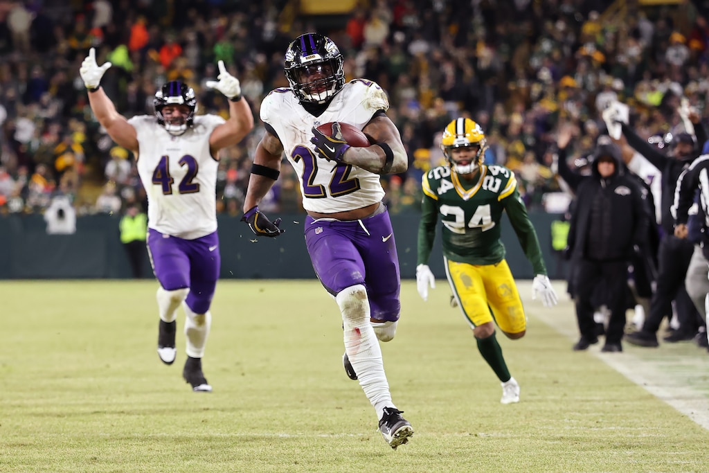GREEN BAY, WISCONSIN - DECEMBER 27: Derrick Henry #22 of the Baltimore Ravens runs with the ball in the fourth quarter against the Green Bay Packers at Lambeau Field on December 27, 2025 in Green Bay, Wisconsin. (Photo by Michael Reaves/Getty Images)