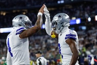 Dallas Cowboys quarterback Dak Prescott (4) celebrates with receiver George Pickens (3)...