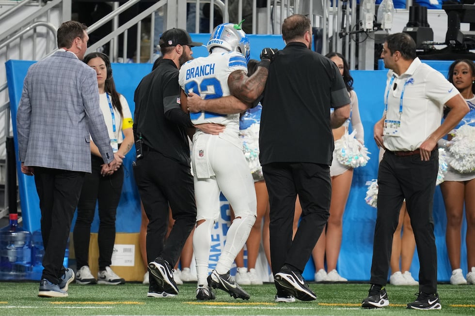 Detroit Lions safety Brian Branch leaves the field with trainers during the second half of an...
