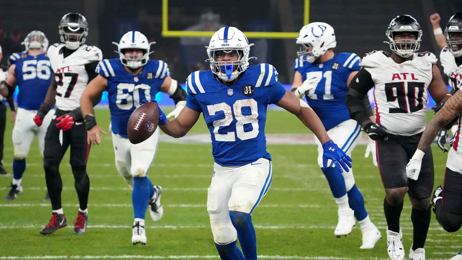 Indianapolis Colts running back Jonathan Taylor (28) scores the winning touchdown in overtime against the Atlanta Falcons during the NFL Berlin Game at Olympic Stadium. 