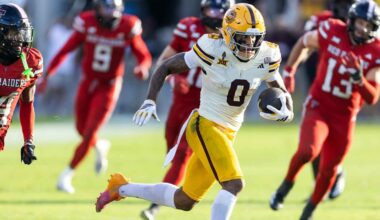 Arizona State Sun Devils wide receiver Jordyn Tyson (0) runs for a touchdown against Utah Utes cornerback Smith Snowden (2) during the third quarter at Rice-Eccles Stadium.