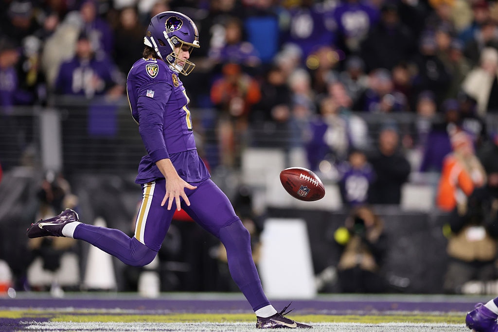 Ravens punter Jordan Stout punts against the Cincinnati Bengals during the second quarter.