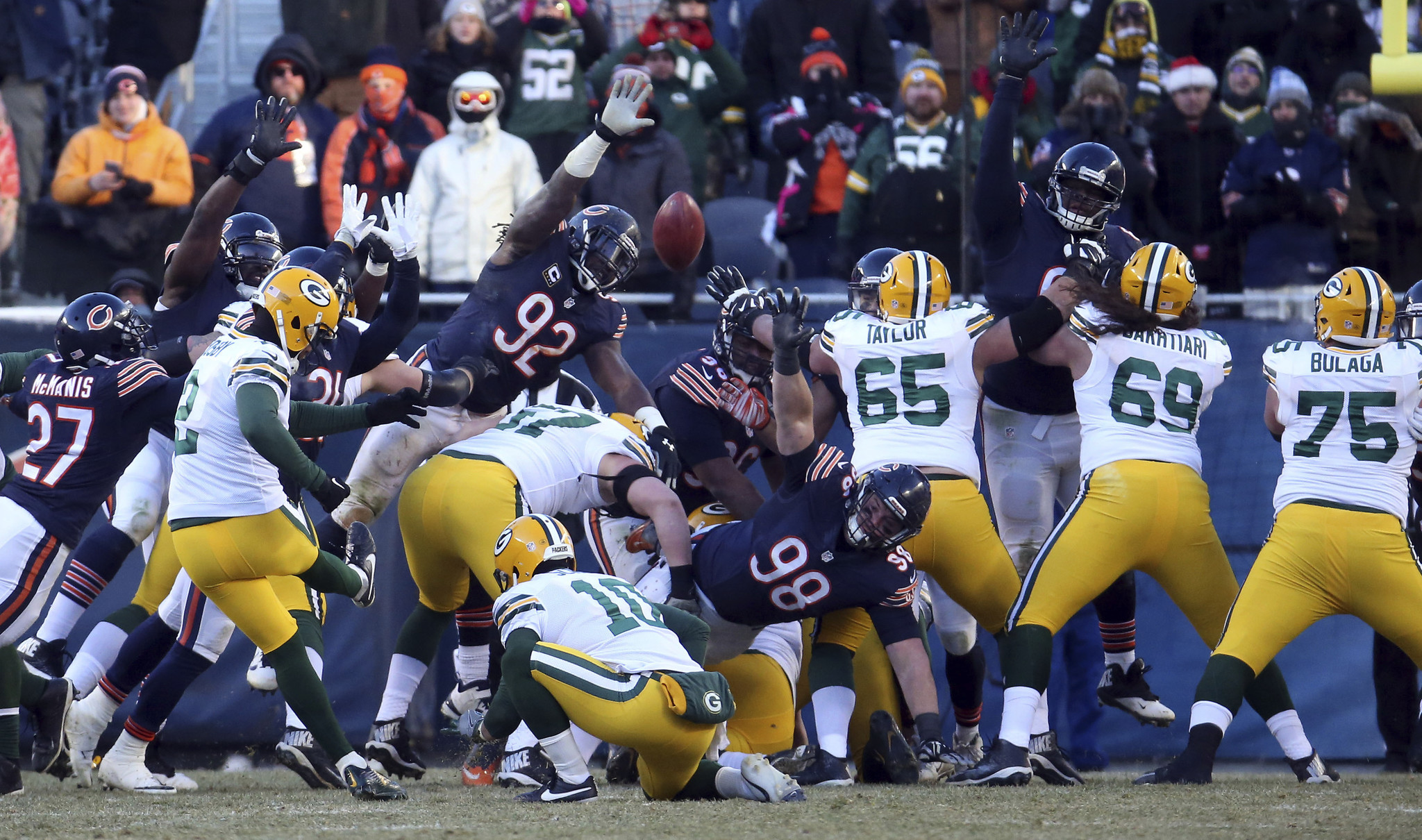 Green Bay Packers kicker Mason Crosby kicks the game-winning field goal through Chicago Bears outside linebacker Pernell McPhee (92) and the line on Dec. 18, 2016 at Soldier Field. The Packers defeated the Bears, 30-27.