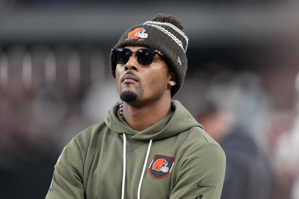 Cleveland Browns player Deshaun Watson, wearing sunglasses and a beanie, at the Las Vegas Raiders game.