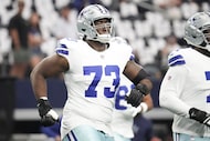Dallas Cowboys guard Tyler Smith (73) warms up before an NFL football game against the New...