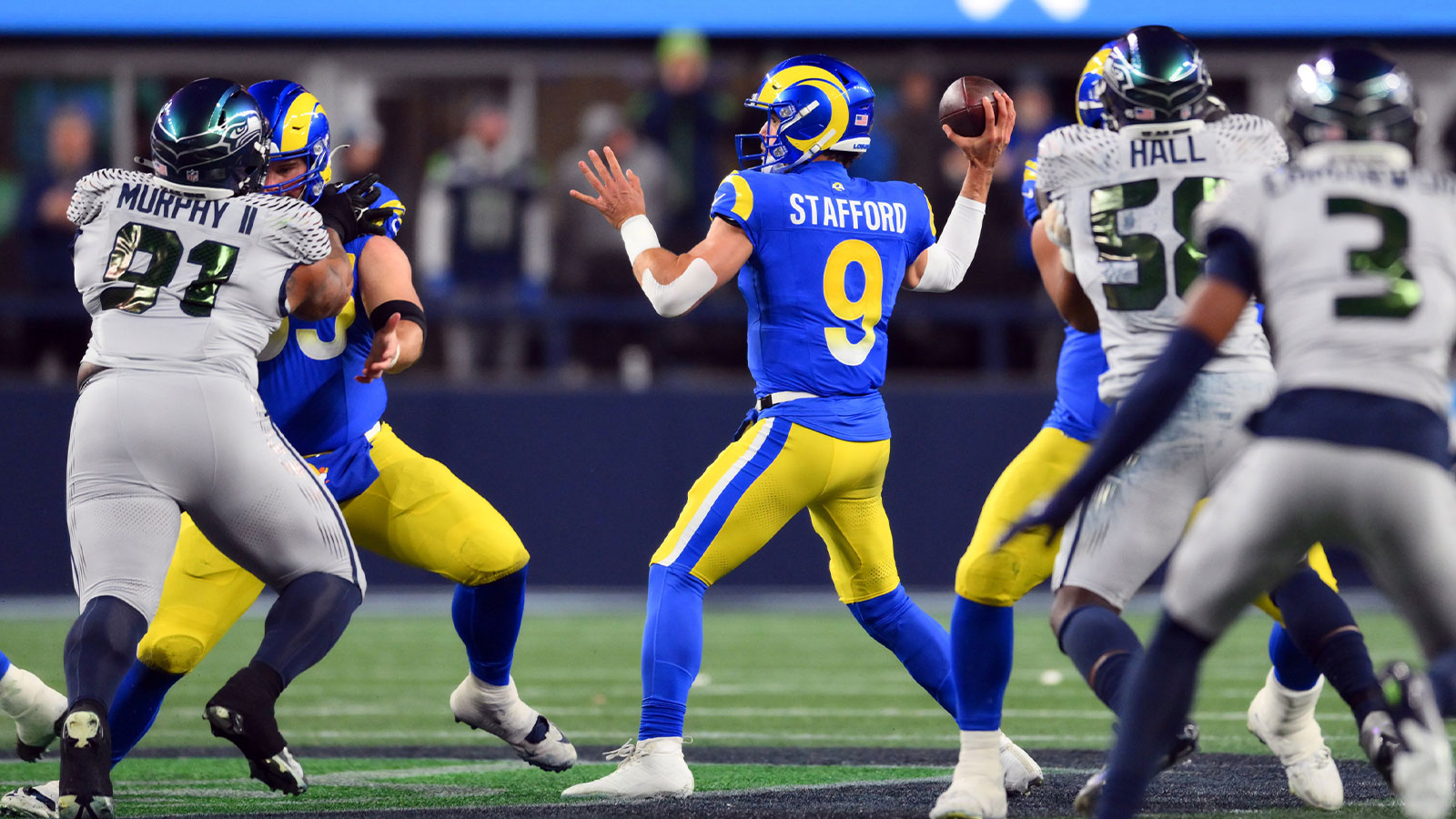 Los Angeles Rams quarterback Matthew Stafford (9) throws a pass against the Seattle Seahawks in the first half at Lumen Field.