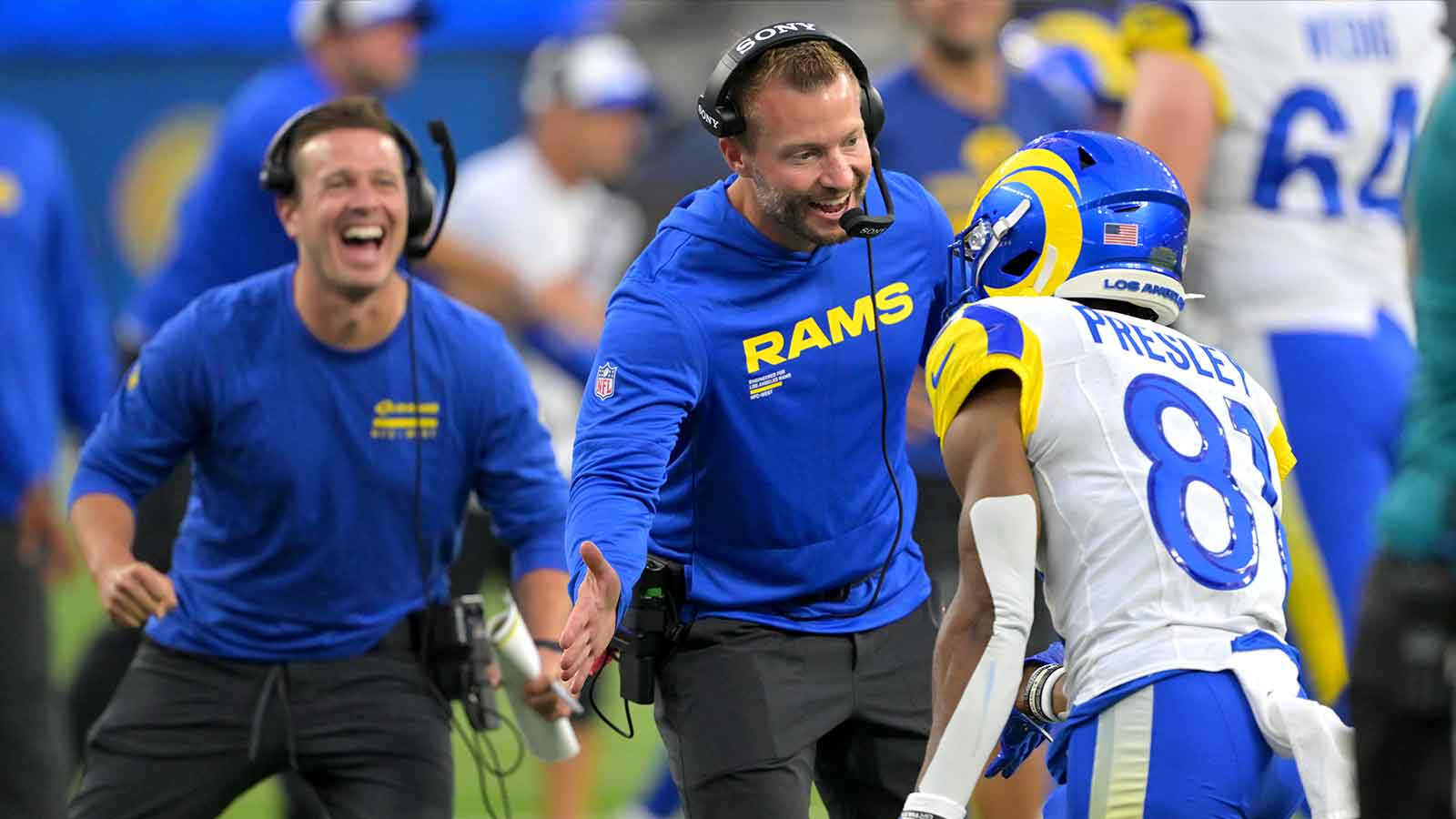 Los Angeles Rams assistant coach Mike LaFleur and head coach Sean McVay congratulate wide receiver Brennan Presley (81) after a touchdown during the second half against the Dallas Cowboys at SoFi Stadium.