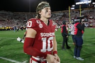Oklahoma quarterback John Mateer (10) leaves the field after the first round of an NCAA...