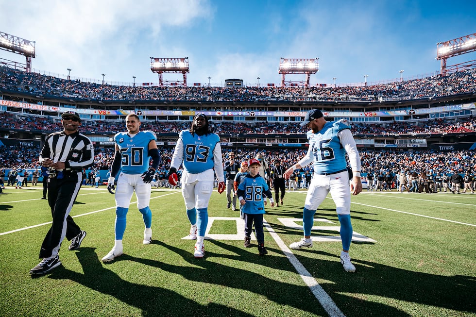 Linebacker Cody Barton #50 of the Tennessee Titans, Defensive tackle T'Vondre Sweat #93 of the...