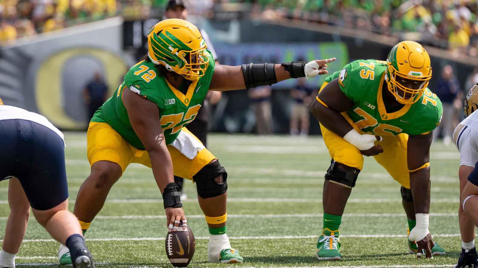 Oregon offensive linemen Iapani Laloulu, left, and Emmanuel Pregnon line up as the Oregon Ducks host the Montana State Bobcats on Aug. 30, 2025, at Autzen Stadium in Eugene, Oregon.