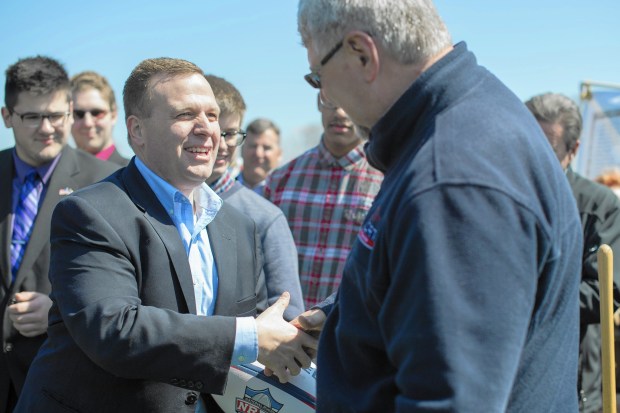 Portage Mayor James Snyder shakes hands with Tony Czapla, managing partner with the Catalyst Lifestyles Sports Resort project, on Tuesday, April 5, 2016, during a groundbreaking event for the Sports Resort in Portage.