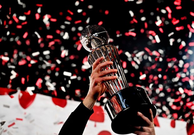Head coach Ryan Day of the Ohio State Buckeyes hoists up the Leishman Trophy after defeating the Oregon Ducks 41-21 to win the 111th Rose Bowl CFP quarterfinal playoff football game in Pasadena on Wednesday, January 1, 2025. (Photo by Keith Birmingham, Orange County Register/ SCNG)