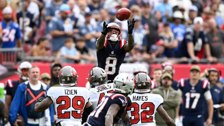 New England Patriots wide receiver Stefon Diggs (8) recovers an onside kick during the second half of an NFL football game against the Tampa Bay Buccaneers, Sunday, Nov. 9, 2025, in Tampa, Fla.