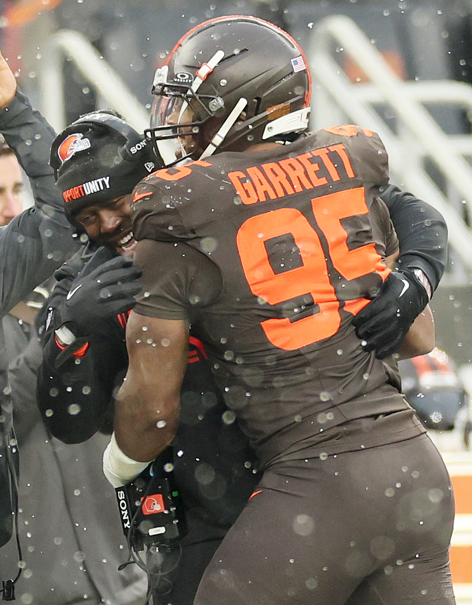 Cleveland Browns defensive end Myles Garrett celebrates his sack in the first half with defensive line coach Jacques Cesaire at Huntington Bank Field.
