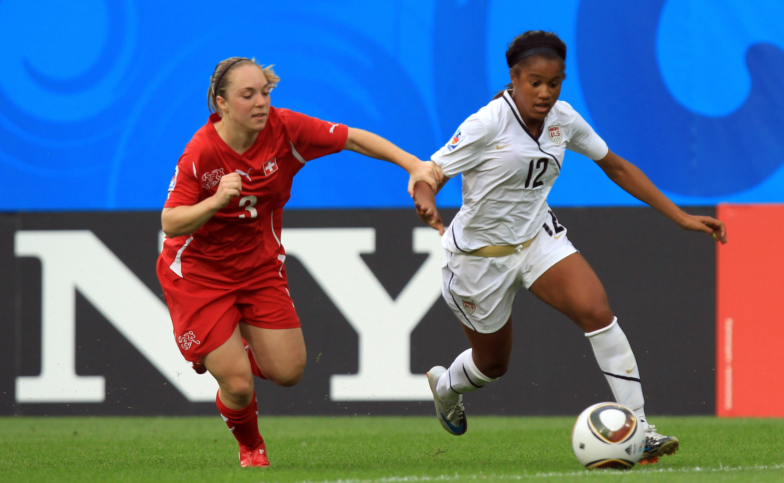 Zakiya Bywaters, right, of the U.S. and Sarah Steinmann of Switzerland battle for the ball during the 2010 Women's World Cup on July 17, 2010, in Dresden, Germany.