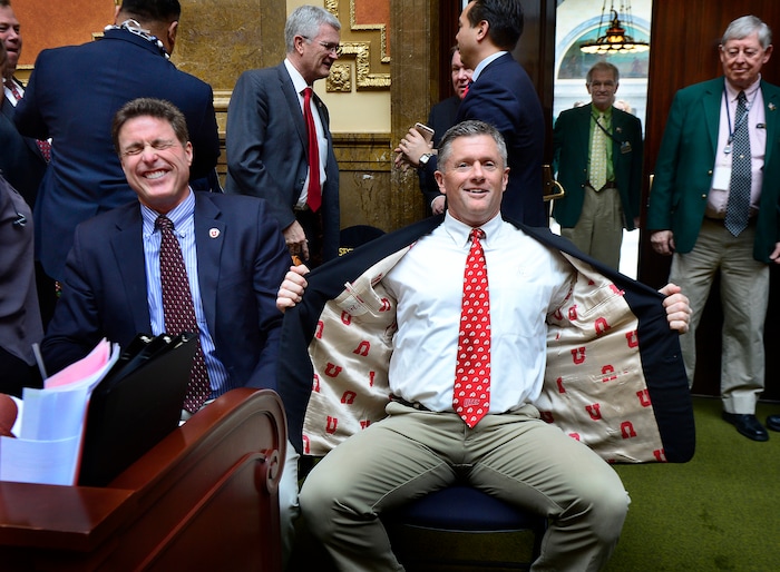 (Scott Sommerdorf | The Salt Lake Tribune) Kyle Whittingham shows off his "U" jacket lining while making a visit at the Utah House of Representatives, Thursday, March 3, 2016.