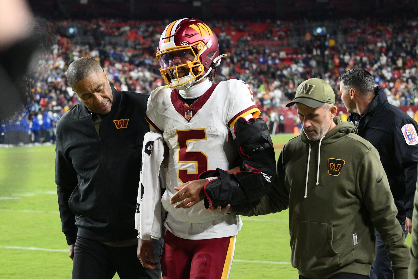 Commanders quarterback Jayden Daniels was helped off the field after injuring his arm against the Seahawks on Nov. 2.