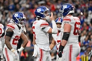New York Giants quarterback Jaxson Dart (6) celebrates his touchdown during the first half...