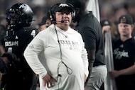 Texas A&M head coach Mike Elko looks on as a play is reviewed during the first quarter of an...
