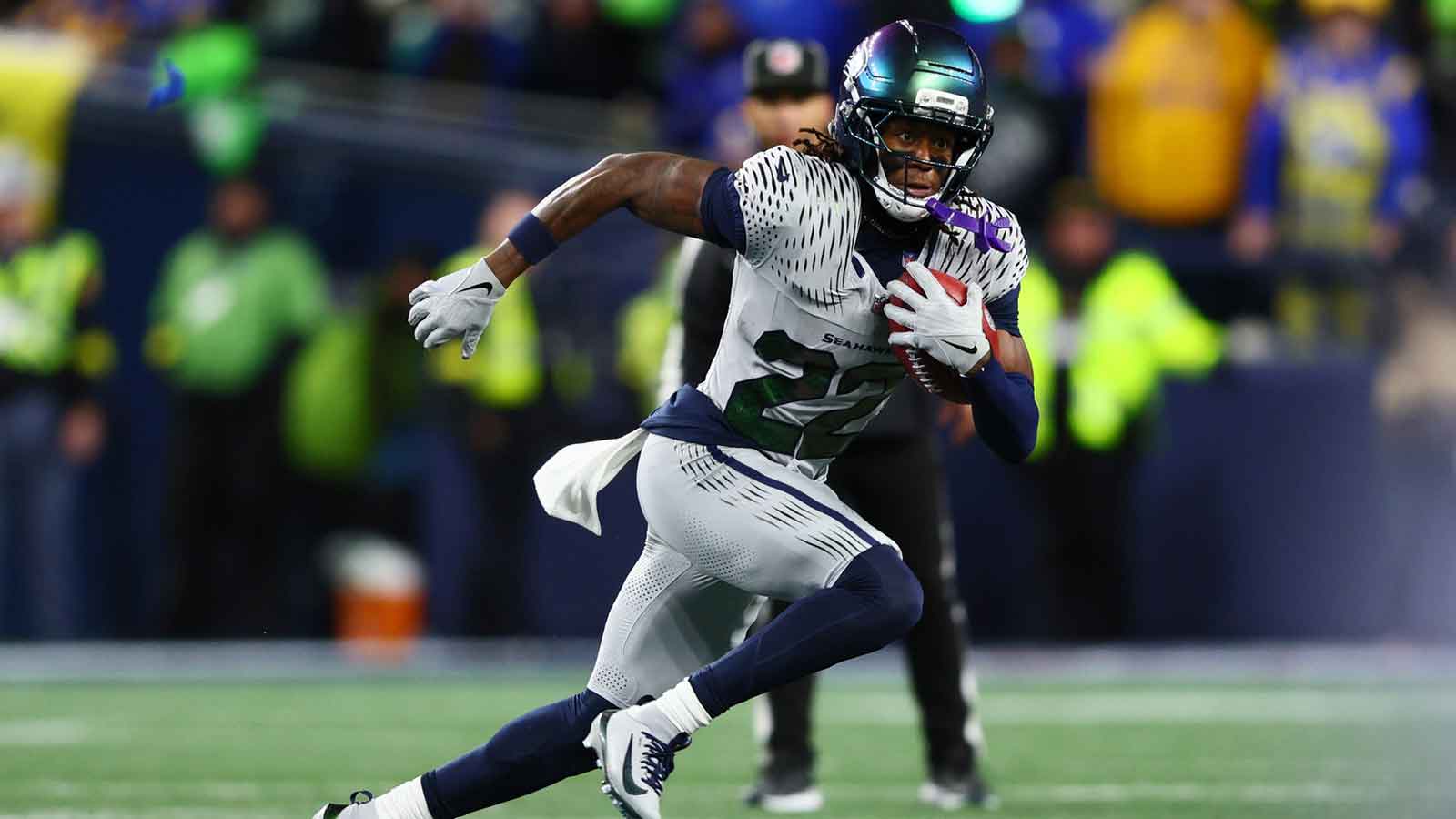 Seattle Seahawks wide receiver Rashid Shaheed (22) returns a punt for a touchdown against the Los Angeles Rams in the second half at Lumen Field.