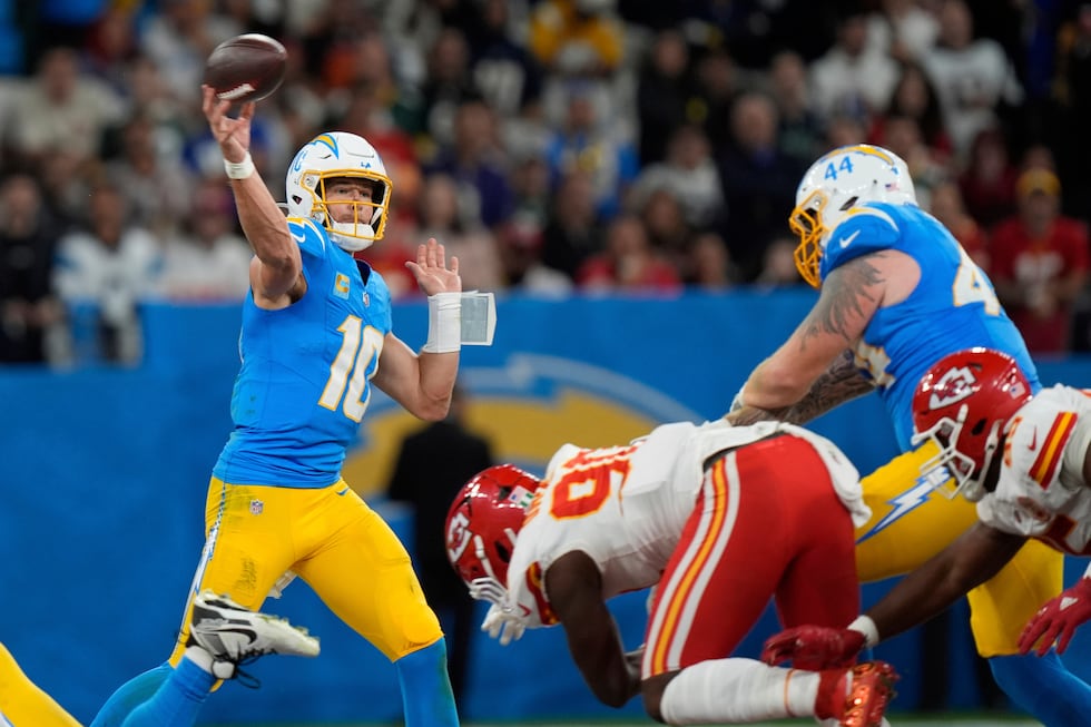 FILE - Los Angeles Chargers quarterback Justin Herbert passes against the Kansas City Chiefs...