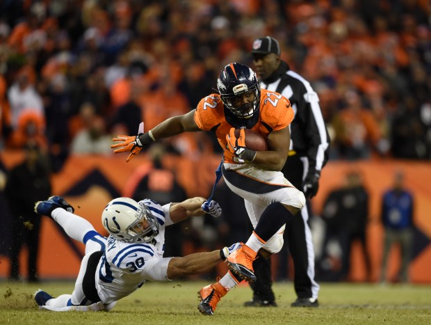 DENVER, CO - JANUARY 11: C.J. Anderson (22) of the Denver Broncos runs for a first down against LaRon Landry (30) of the Indianapolis Colts. The Denver Broncos played the Indianapolis Colts in an AFC divisional playoff game at Sports Authority Field at Mile High in Denver on January 11, 2015. (Photo by AAron Ontiveroz/The Denver Post)
