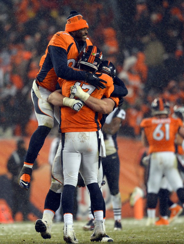 DENVER, CO - NOVEMBER 29: Denver Broncos defensive end Malik Jackson (97) and Denver Broncos guard Evan Mathis (69) celebrate with Denver Broncos quarterback Brock Osweiler (17) after their win in overtime over the New England Patriots 30-24 November 29, 2015 at Sports Authority Field at Mile High Stadium. (Photo By Helen H. Richardson/The Denver Post)