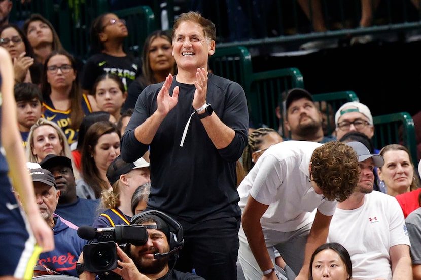 Mavericks minority owner Mark Cuban cheers during the second half of an WNBA basketball game...