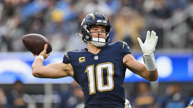 Los Angeles Chargers quarterback Justin Herbert (10) passes the ball during the first half of an NFL football game against the Las Vegas Raiders, Sunday, Nov. 30, 2025, in Inglewood, Calif. (AP Photo/William Liang)