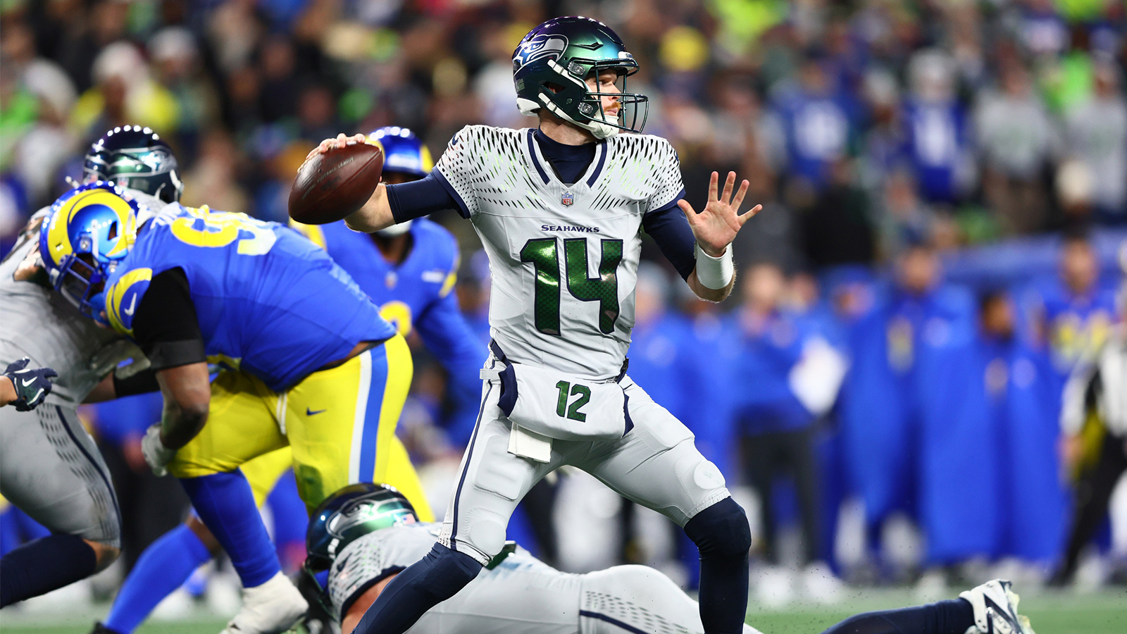 Los Angeles Rams quarterback Matthew Stafford (9) throws a pass against the Seattle Seahawks in overtime at Lumen Field.