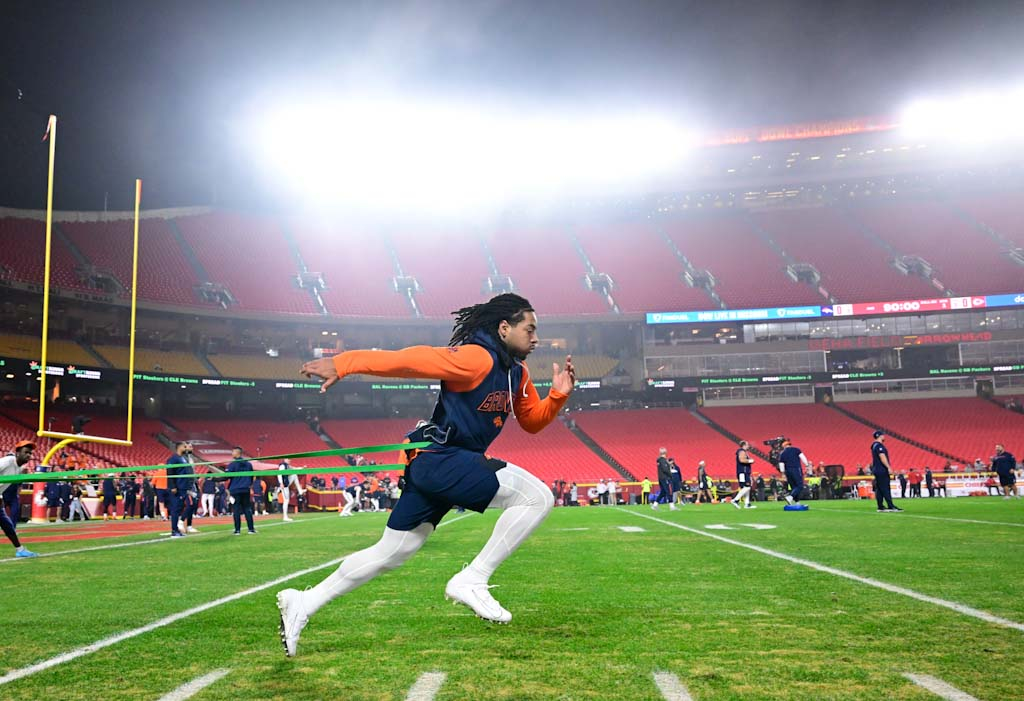 Denver Broncos safety P.J. Locke (6) during a stretching routine...