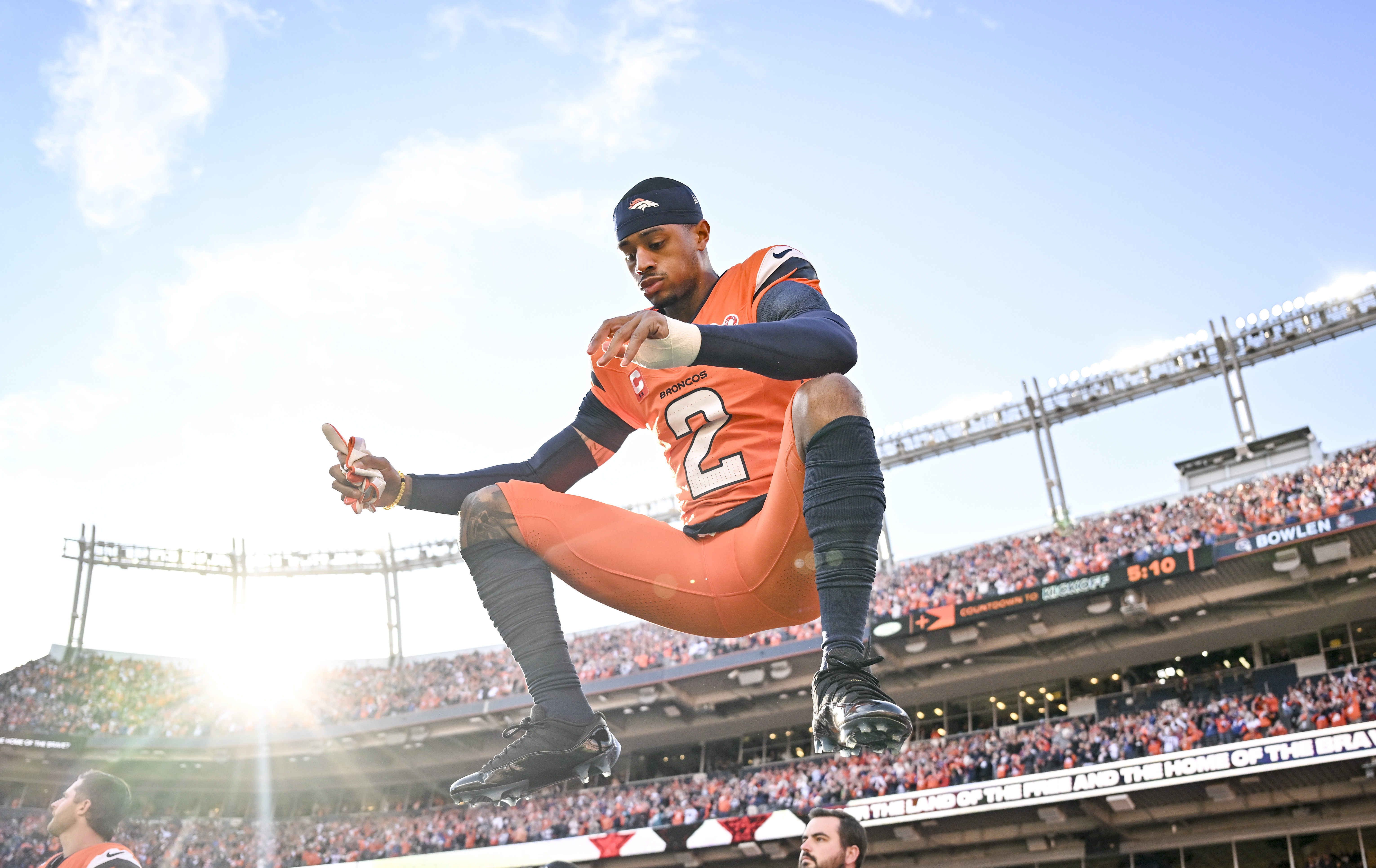 Pat Surtain II (2) of the Denver Broncos gets warm...