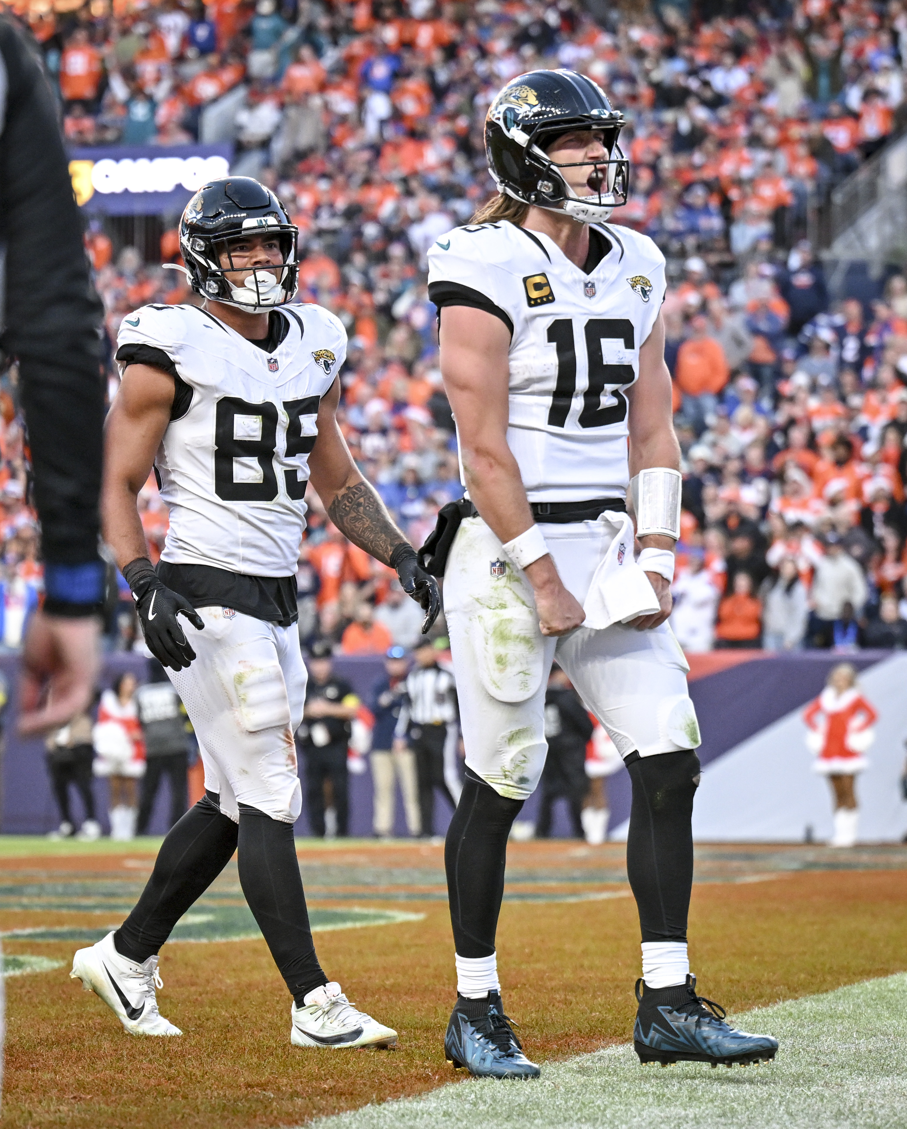 Trevor Lawrence (16) of the Jacksonville Jaguars celebrates rushing for...