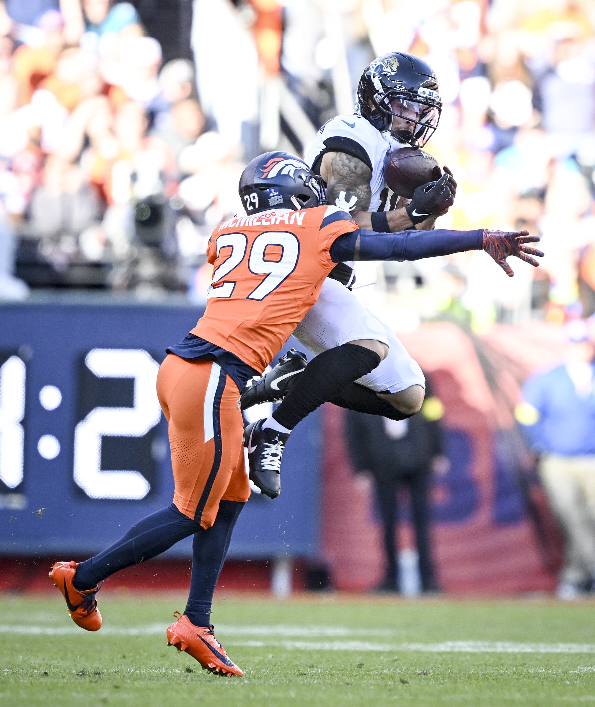Parker Washington (11) of the Jacksonville Jaguars secures a catch...