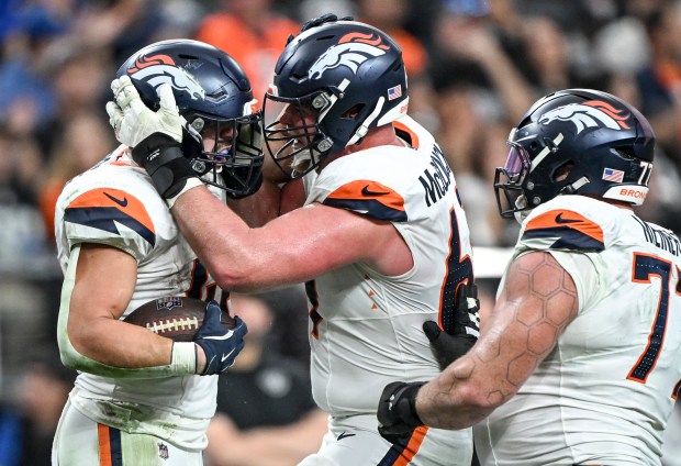LAS VEGAS , NV - DECEMBER 7: Adam Prentice (46) of the Denver Broncos celebrates running for a first down with Mike McGlinchey (69) and Quinn Meinerz (77) during the third quarter of the Broncos' 24-17 win at Allegiant Stadium in Las Vegas, Nevada on Sunday, December 7, 2025. (Photo by AAron Ontiveroz/The Denver Post)