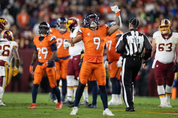 Safety Talanoa Hufanga (9) of the Denver Broncos celebrates a tackle for loss against the Washington Commanders on Sunday, Nov. 30, 2025, at Northwest Stadium in Landover, MD. (Photo by Timothy Hurst/The Denver Post)