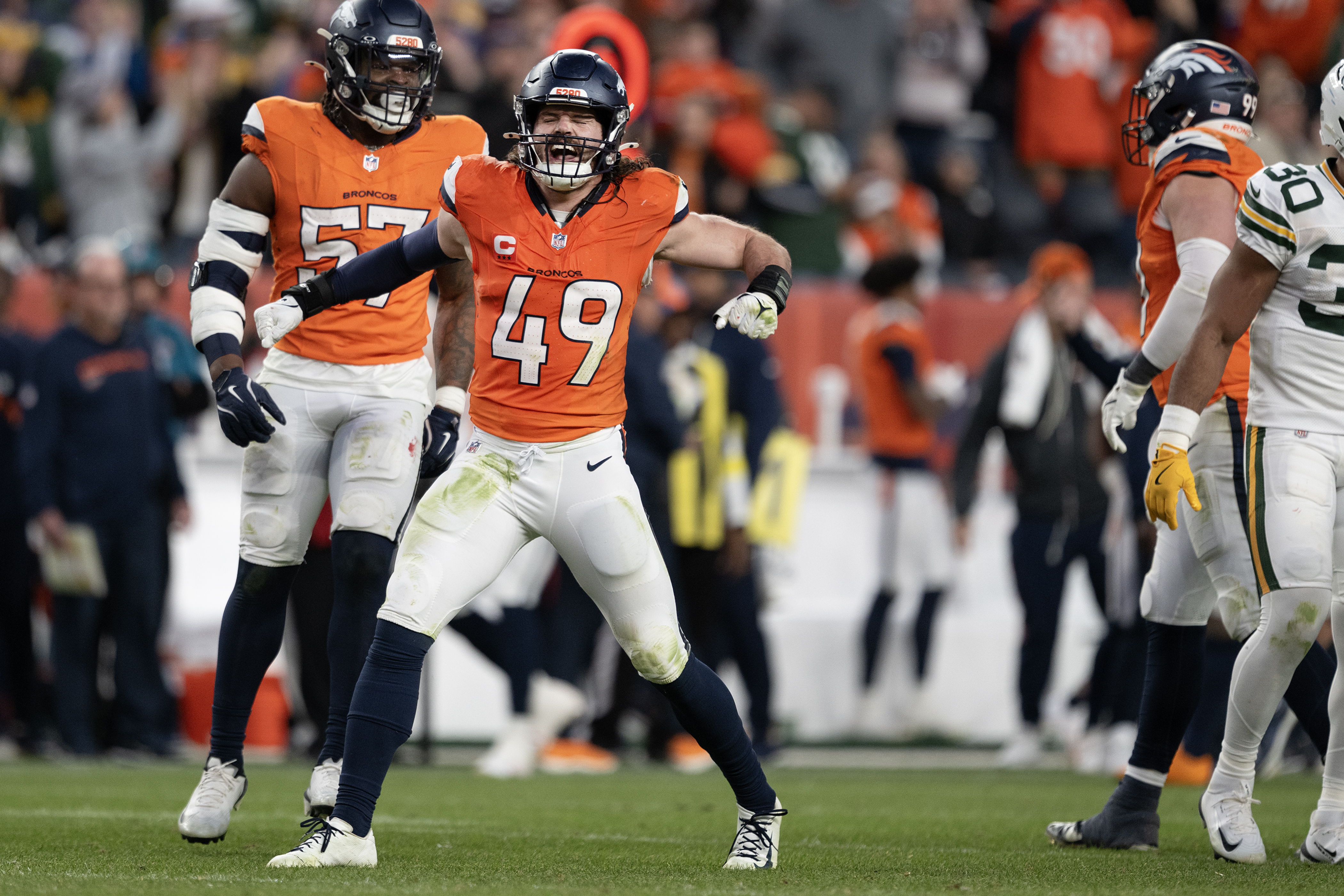 Linebacker Alex Singleton (49) of the Denver Broncos celebrates sacking...