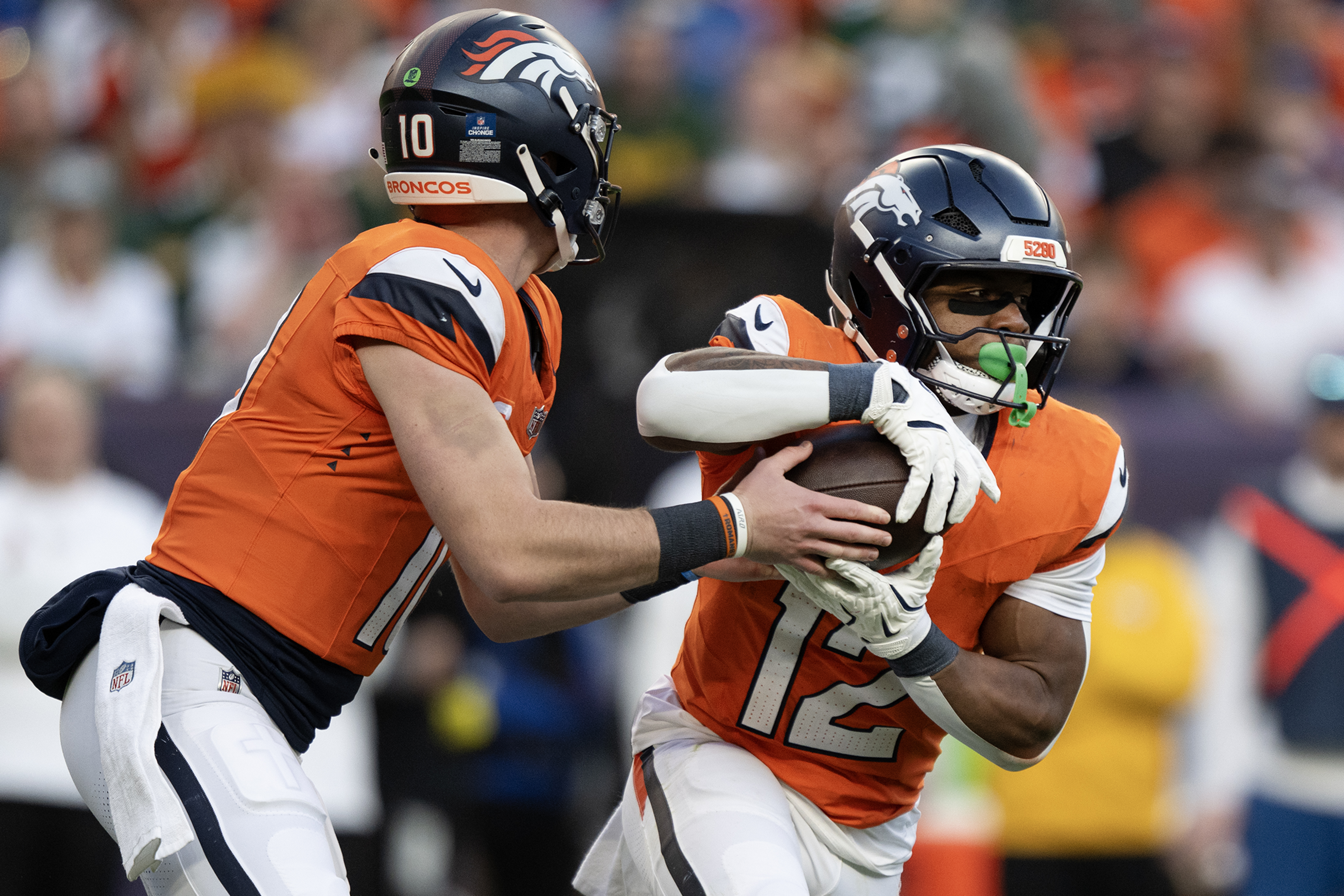 Running back RJ Harvey (12) of the Denver Broncos takes...