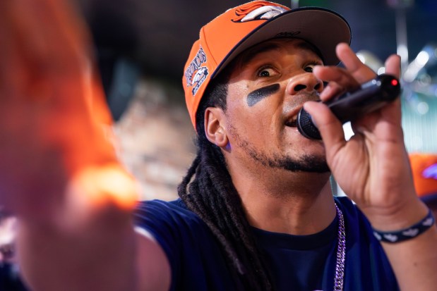 Andrew Young, The Mad Fanatic, performs rap songs about the Denver Broncos at The Point Sports Bar and Grill in Thornton on Saturday, Nov. 15, 2025. (Photo by McKenzie Lange/Special to The Denver Post)