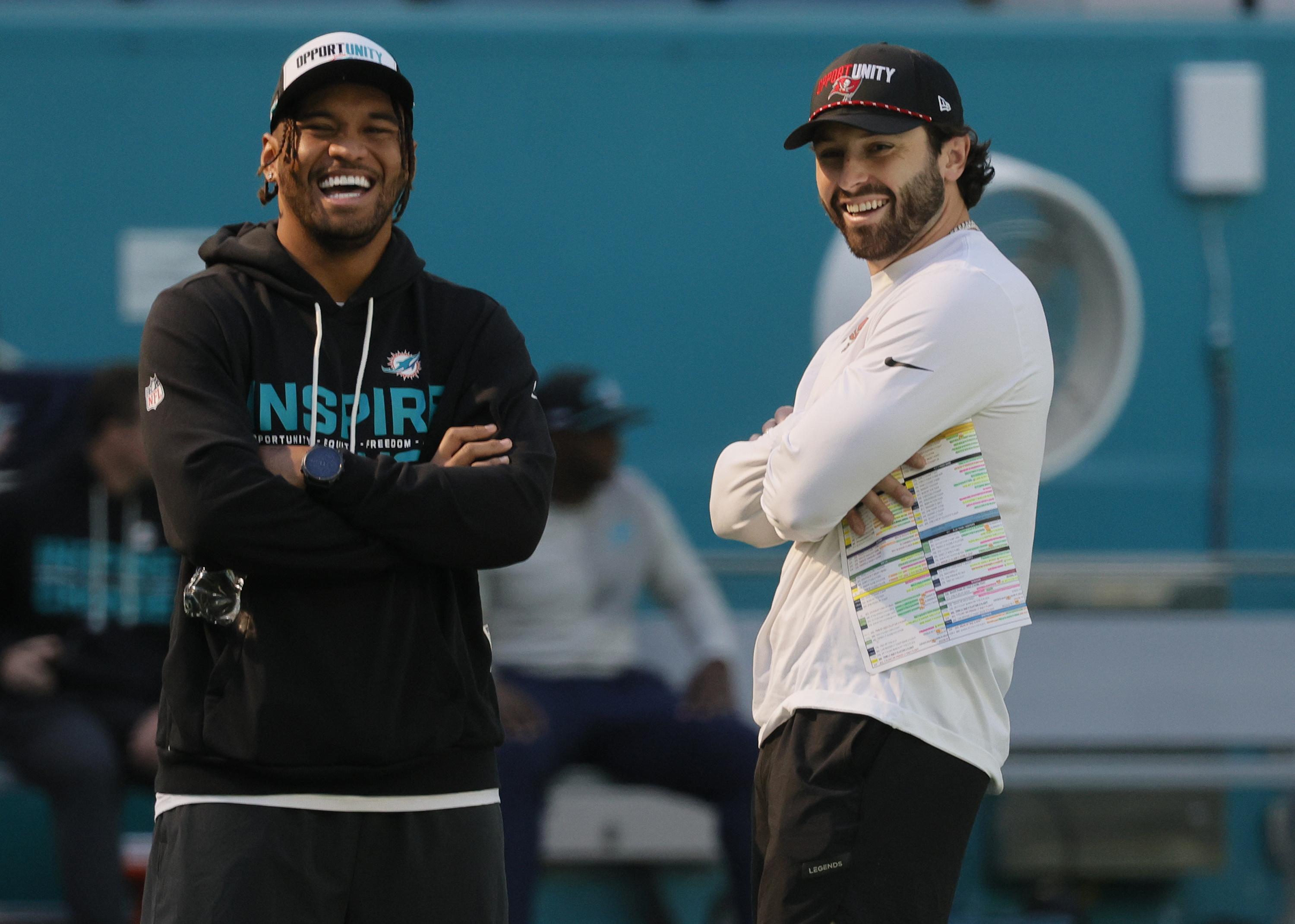 Miami Dolphins quarterback Tua Tagovailoa (1) and Tampa Bay Buccaneers...