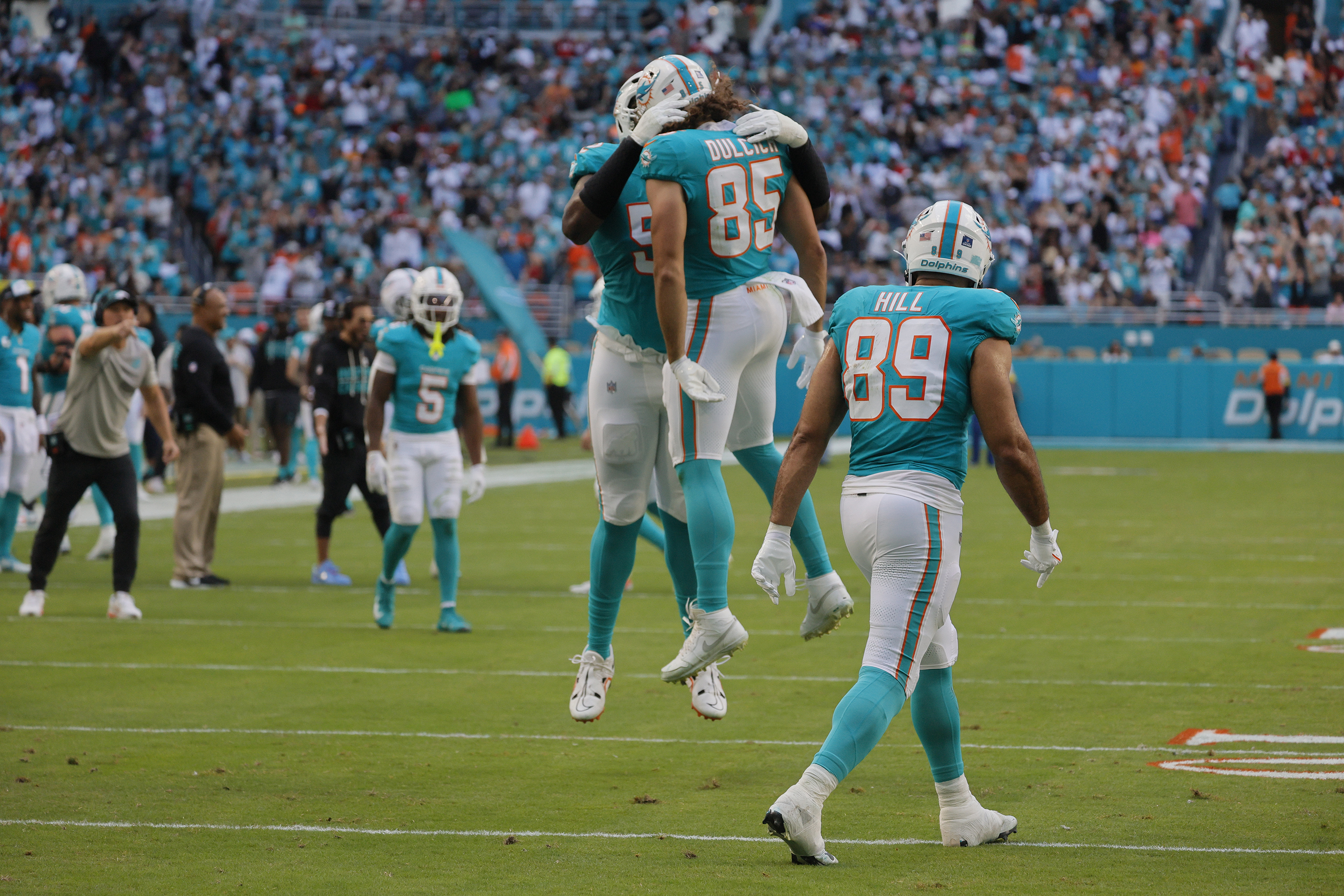 Miami Dolphins tight end Greg Dulcich (85) celebrates a touchdown...