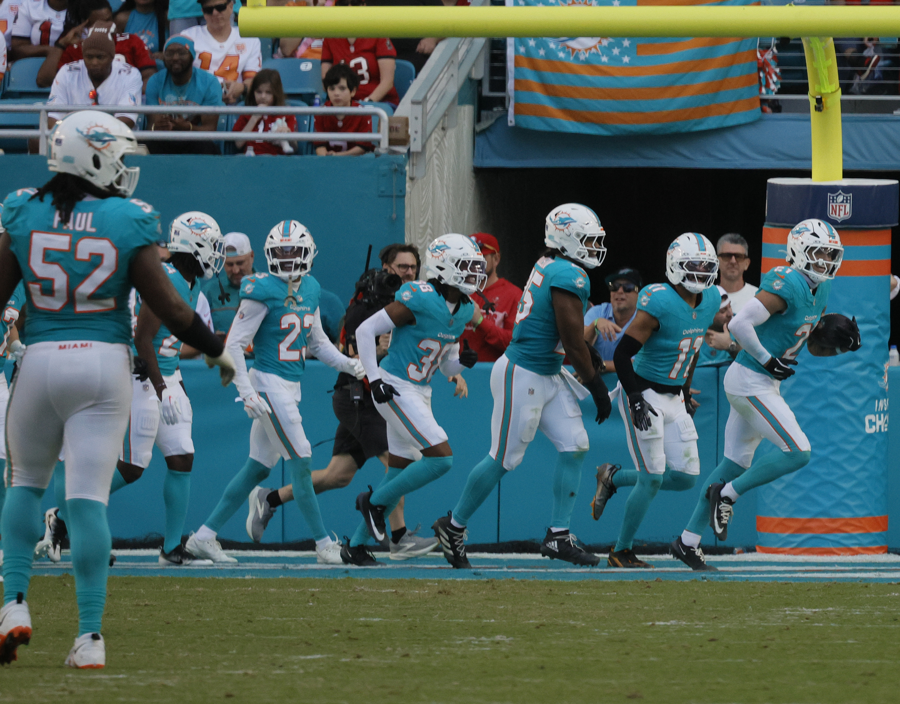 Miami Dolphins safety Ashtyn Davis (21) runs off the field...
