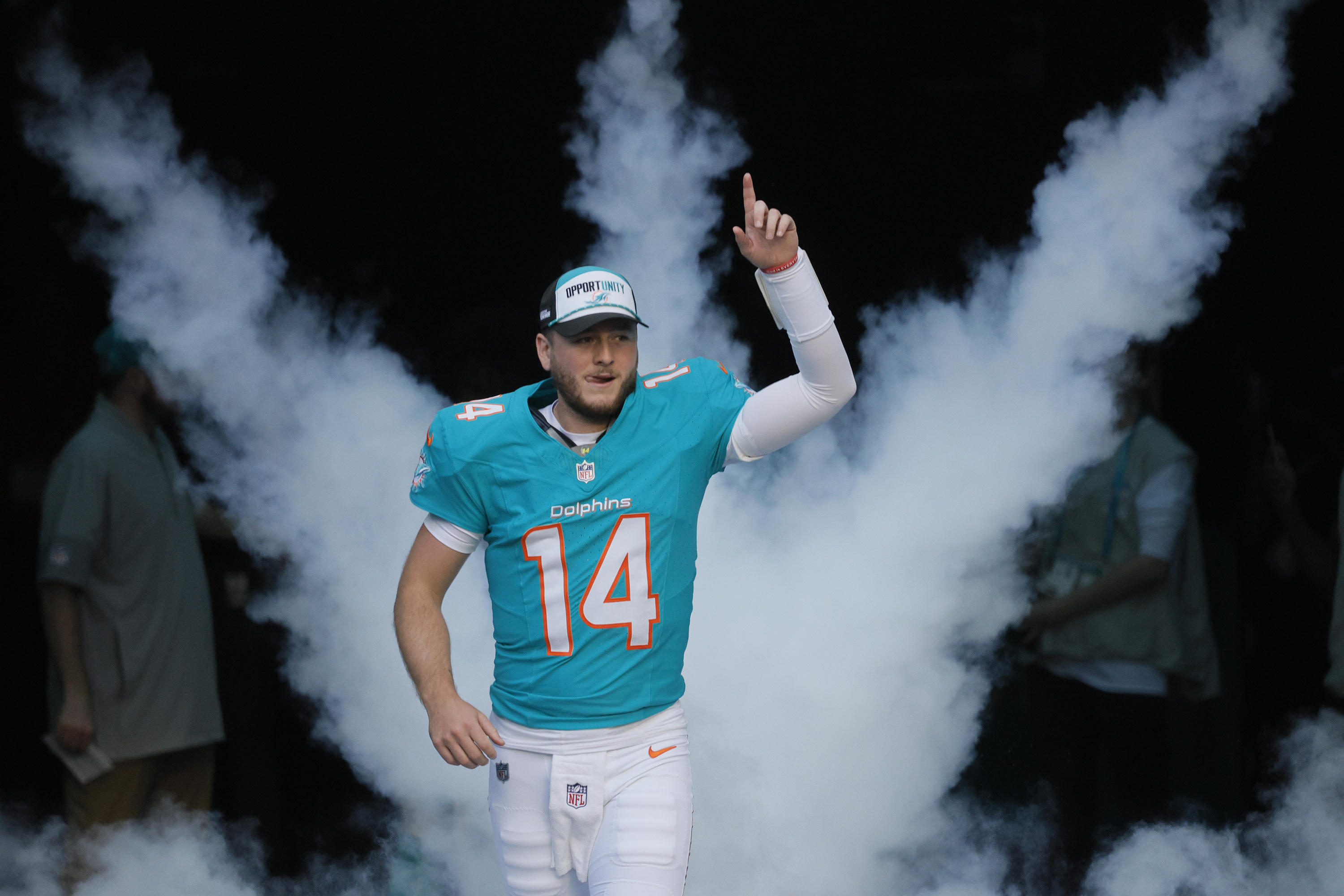 Miami Dolphins quarterback Quinn Ewers (14) takes the field before...