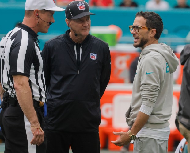 Miami Dolphins head coach Mike McDaniel meets with officials before...