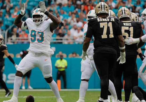 Miami Dolphins defensive tackle Zeek Biggers (93) celebrates a sack...