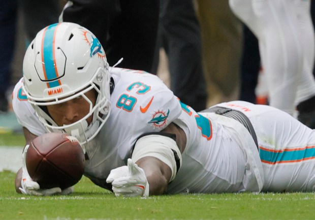 Miami Dolphins tight end Darren Waller indicates a first down...