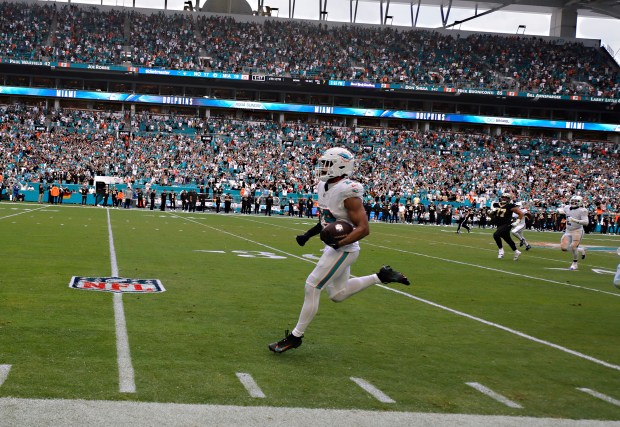 Miami Dolphins safety Minkah Fitzpatrick (29) runs back an interception...